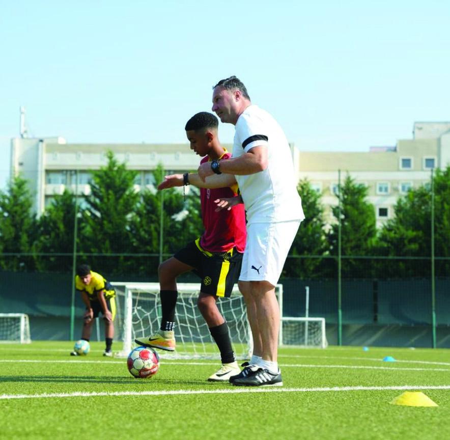 A young footballer receiving coaching at the Dinamo Tbilisi Academy camp